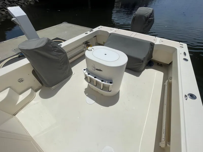 Slide: The Image of 2008 Parker 2520 XL Sport Cabin boat deck with covered seating and equipment. - 8