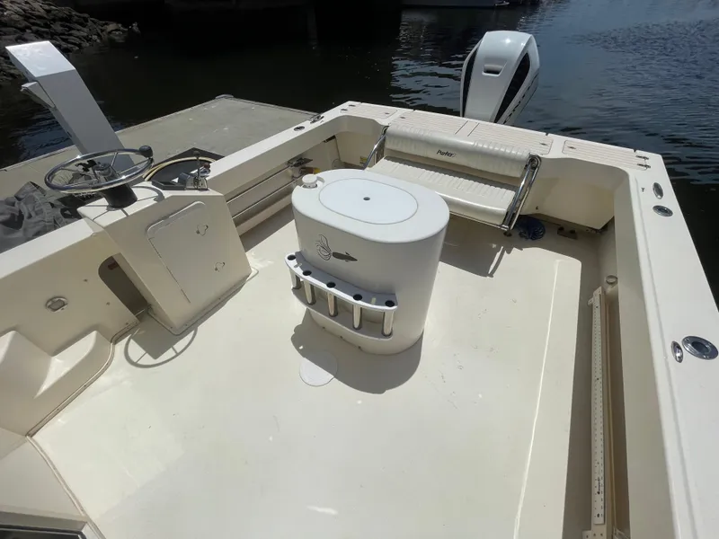 Slide: The Image of 2008 Parker 2520 XL Sport Cabin boat deck with seating and storage. - 9