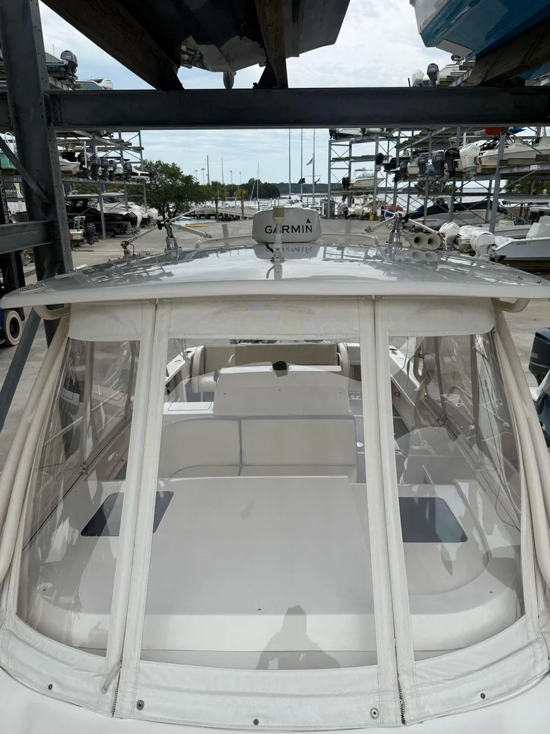 Slide: The Image of 2007 Intrepid 35 Walkaround boat with Garmin equipment, docked in a marina. - 13