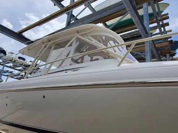Slide: The Image of 2007 Intrepid 35 Walkaround boat in storage, showcasing sleek design and sturdy construction. - 15