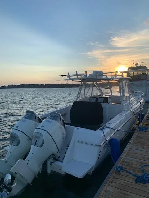 Slide: The Image of 2007 Intrepid 35 Walkaround boat docked at sunset with dual engines. - 16