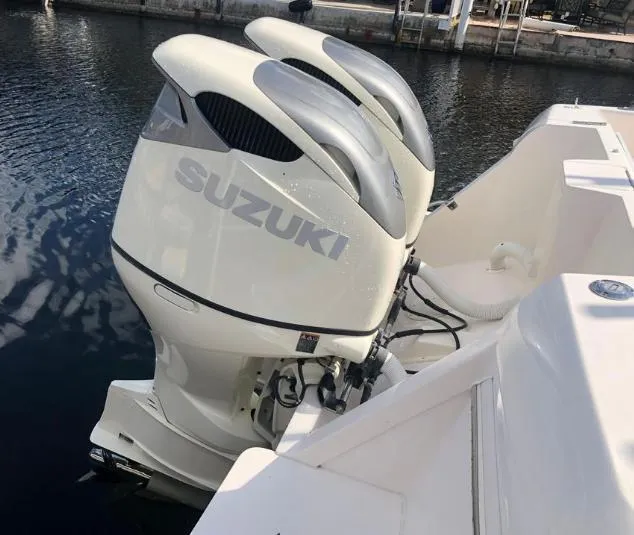 Slide: The Image of Twin Suzuki outboard engines on a 2007 Intrepid 35 Walkaround boat. - 22