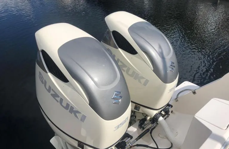 Slide: The Image of Twin Suzuki outboard engines on a 2007 Intrepid 35 Walkaround boat. - 23