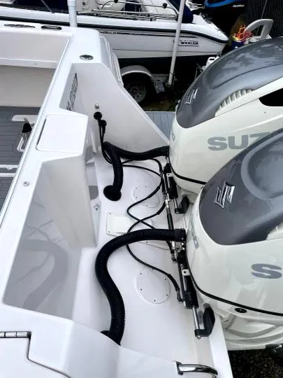 Slide: The Image of 2007 Intrepid 35 Walkaround with dual Suzuki outboard engines, docked in a marina. - 24