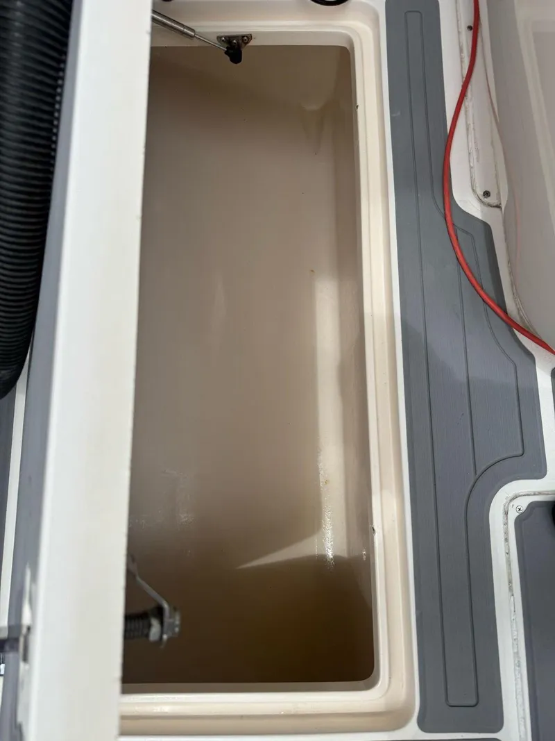 Slide: The Image of Open storage compartment on a 2007 Intrepid 35 Walkaround boat. - 29