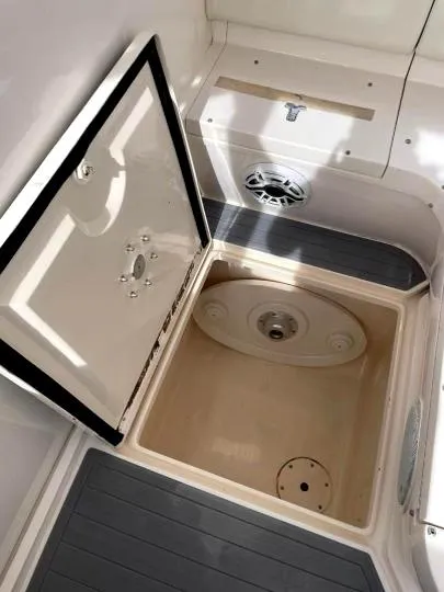 Slide: The Image of 2007 Intrepid 35 Walkaround storage compartment with open hatch and speaker. - 31