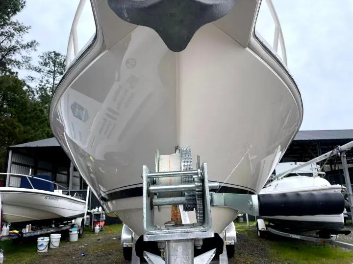 Slide: The Image of 2007 Intrepid 35 Walkaround boat on trailer, front view, in a storage area. - 32