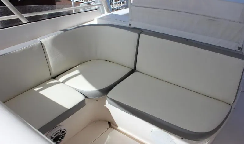 Slide: The Image of 2007 Intrepid 35 Walkaround boat seating area with white cushions. - 6