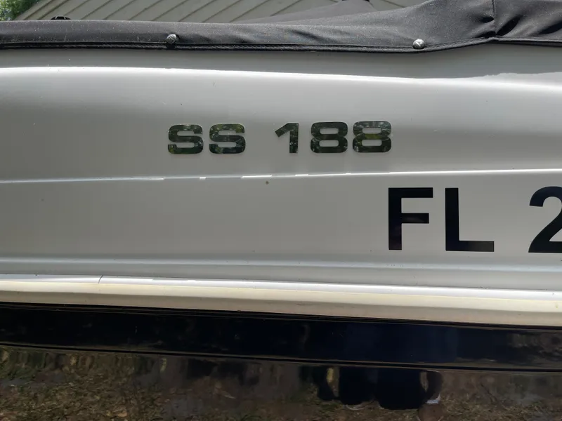 Slide: The Image of 2022 Hurricane SunDeck Sport 188 OB boat with registration number FL 2 visible. - 21