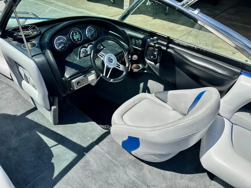 Slide: The Image of 2006 Calabria Boats Wakeboard Boat Cal-Air Pro-V interior with steering wheel and dashboard controls. - 12