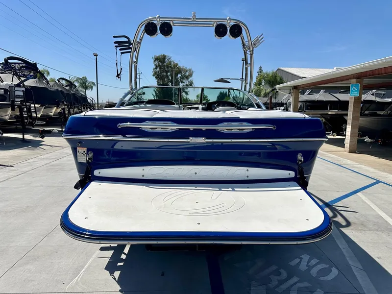 Slide: The Image of 2006 Calabria Boats Wakeboard Boat Cal-Air Pro-V, rear view in marina setting. - 6