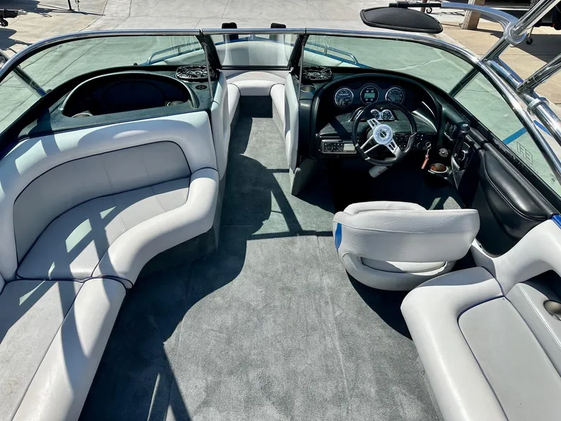Slide: The Image of 2006 Calabria Boats Wakeboard Boat Cal-Air Pro-V interior with seating and dashboard view. - 7