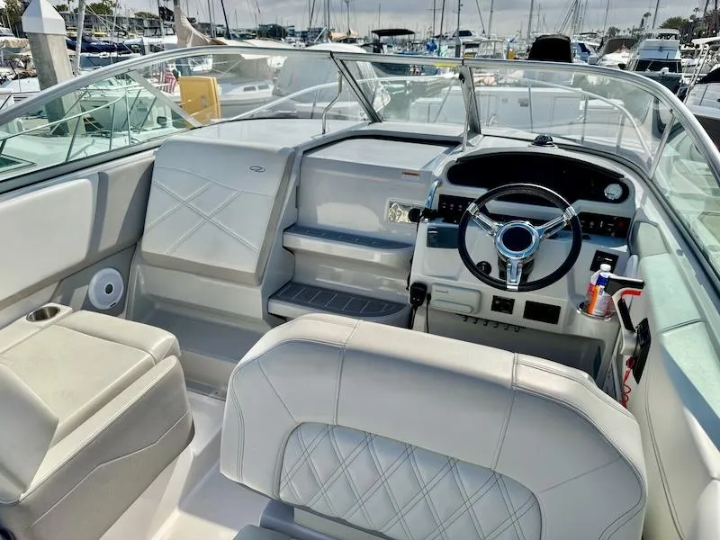 Slide: The Image of Interior of a 2020 Regal 26 XO boat with modern steering and seating. - 19