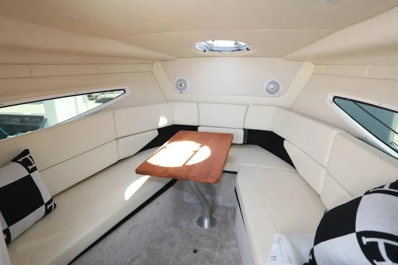 Slide: The Image of Luxurious interior of 2020 Regal 26 XO boat with plush seating and wooden table. - 25