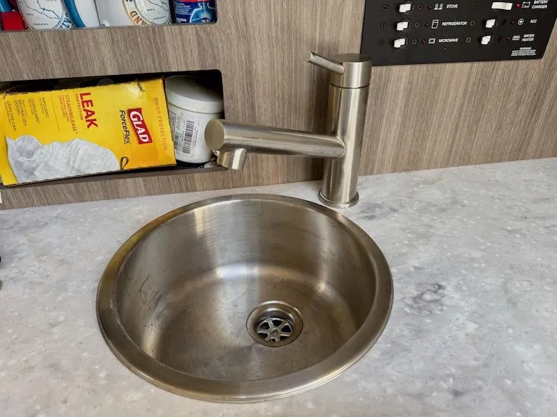 Slide: The Image of Stainless steel sink and faucet in 2020 Regal 26 XO boat interior. - 38