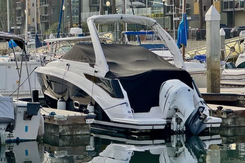 Slide: The Image of 2020 Regal 26 XO boat docked in marina, covered and secured. - 4
