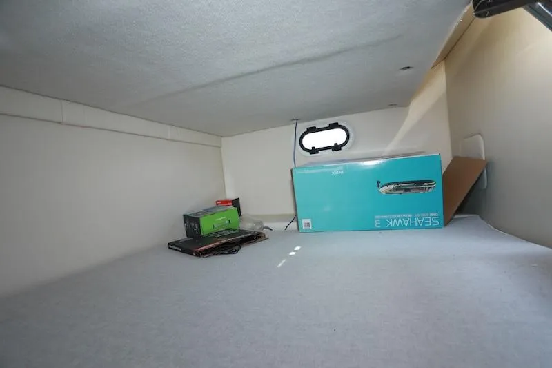 Slide: The Image of Interior cabin storage of 2020 Regal 26 XO boat with boxes and equipment. - 40