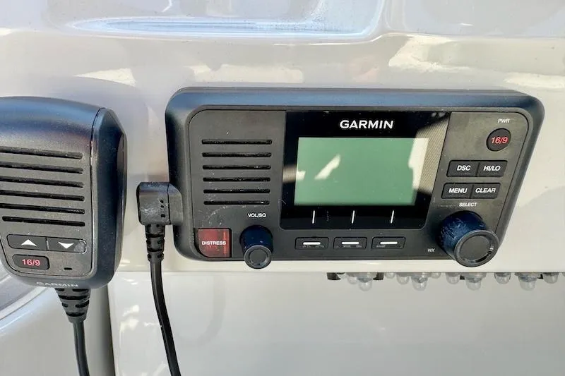 Slide: The Image of Garmin marine radio on 2020 Regal 26 XO boat dashboard. - 43