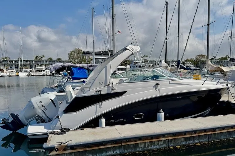 Slide: The Image of 2020 Regal 26 XO boat docked in a marina with clear skies. - 5