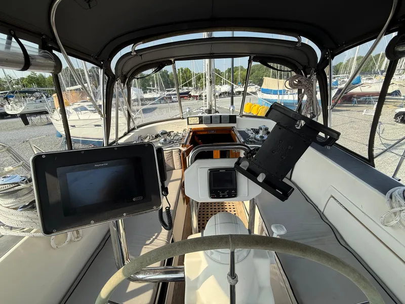 Slide: The Image of Cockpit of 1997 Westerly Oceanlord sailboat with navigation equipment and steering wheel. - 14