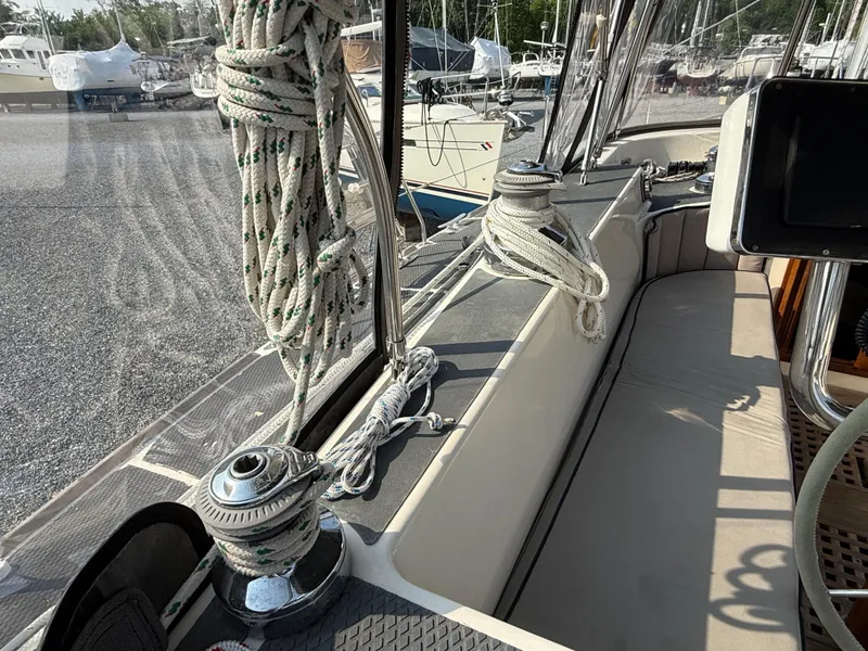 Slide: The Image of 1997 Westerly Oceanlord sailboat deck with winches and ropes, docked in a marina. - 15