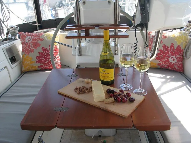 Slide: The Image of Cozy yacht dining setup with wine, cheese, and fruit on a 1997 Westerly Oceanlord. - 19