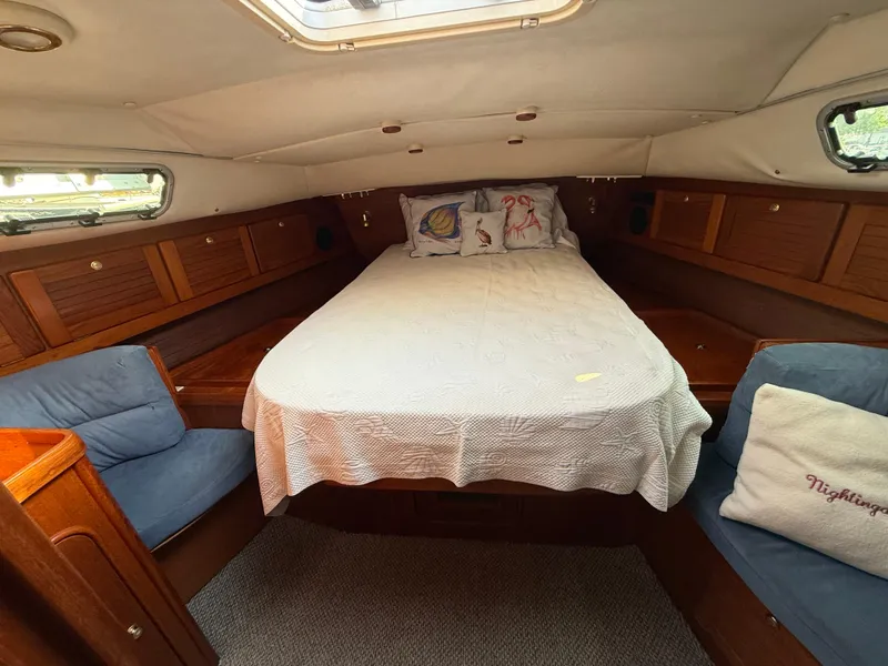 Slide: The Image of Cozy cabin interior of 1997 Westerly Oceanlord yacht with bed and seating. - 38