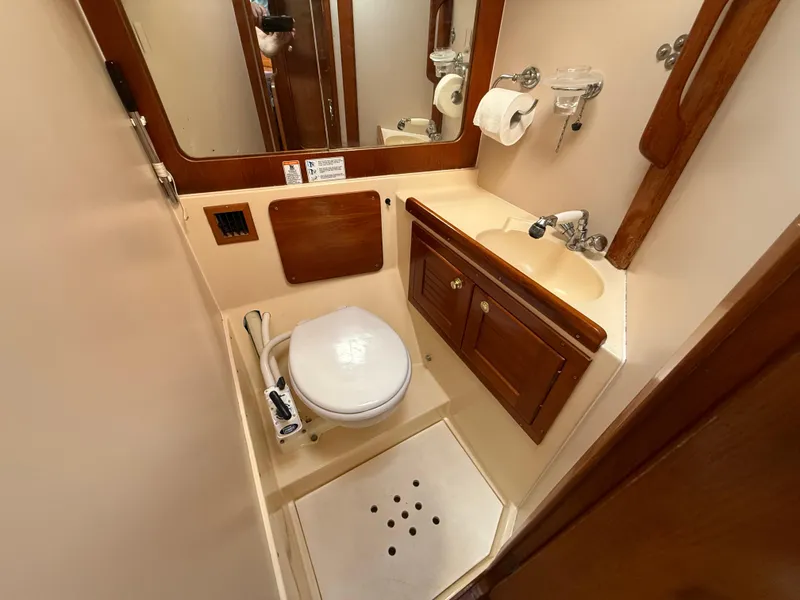 Slide: The Image of 1997 Westerly Oceanlord yacht bathroom with wooden cabinetry and compact design. - 43