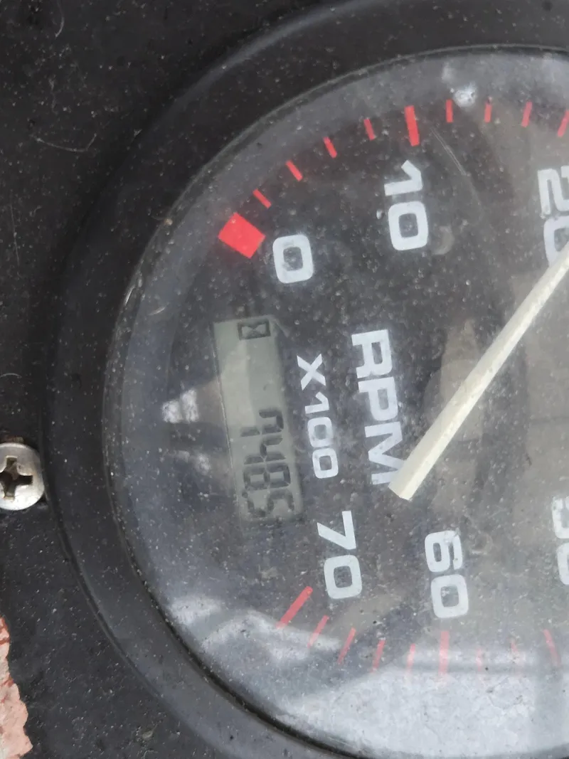 Slide: The Image of Close-up of a 1999 Shamrock 220 Open RPM gauge showing 7405 RPM. - 15