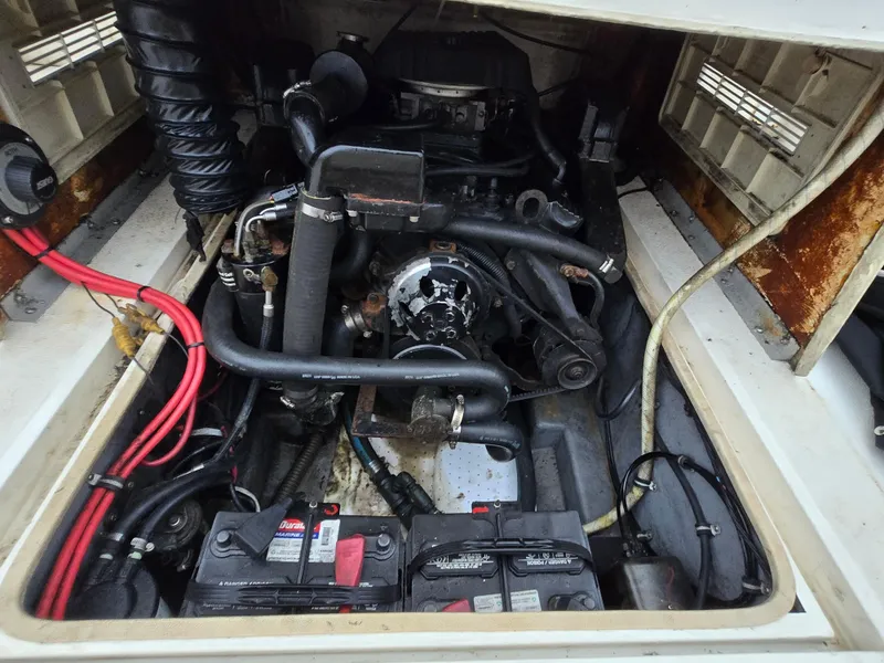 Slide: The Image of Engine compartment of a 1999 Shamrock 220 Open boat, showing wiring and components. - 17