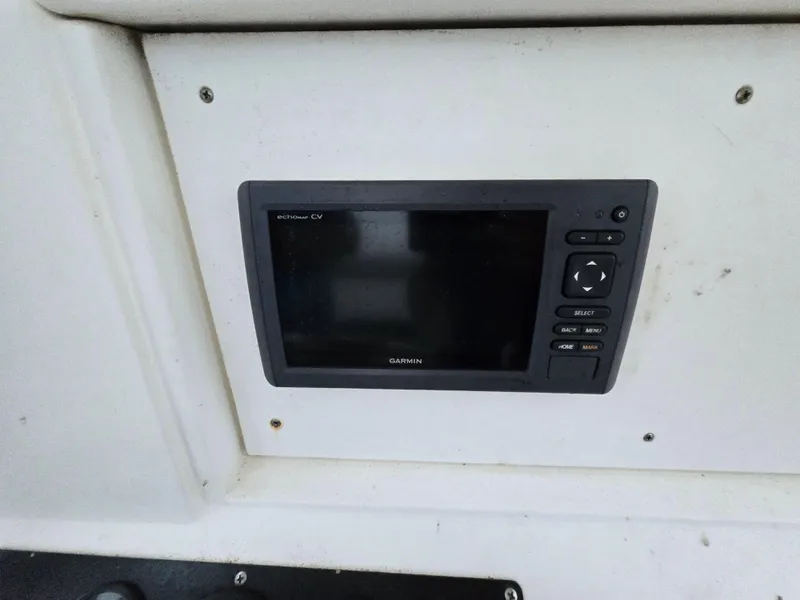 Slide: The Image of Garmin marine GPS device on 1999 Shamrock 220 Open boat dashboard. - 8