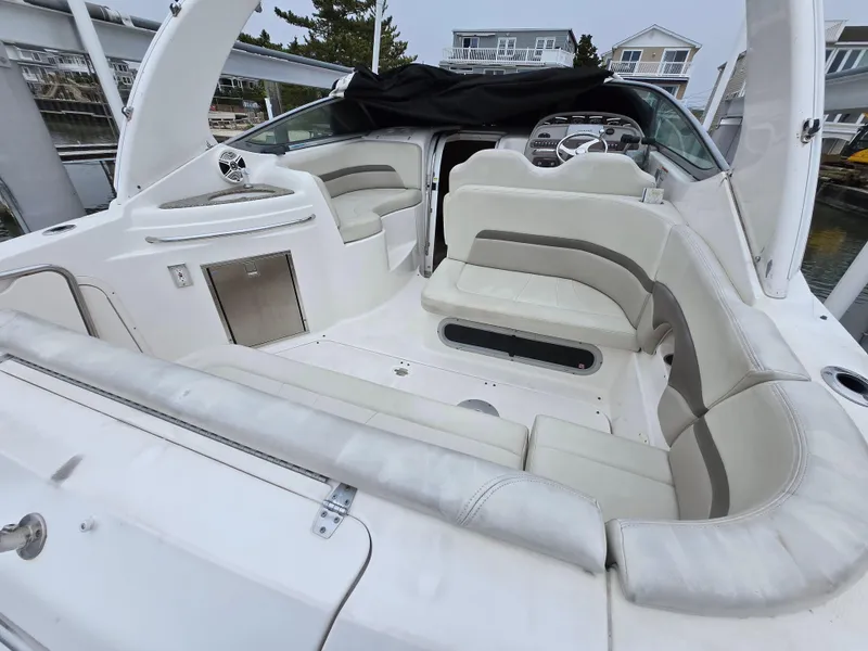 Slide: The Image of 2008 Chaparral 290 Signature boat interior with white seating and steering wheel. - 12