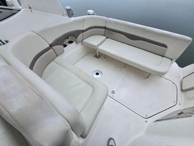 Slide: The Image of 2008 Chaparral 290 Signature boat interior with beige seating and cup holders. - 13