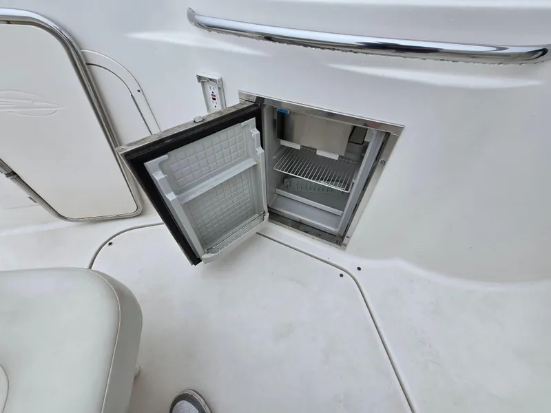 Slide: The Image of Open mini fridge on 2008 Chaparral 290 Signature boat deck. - 14