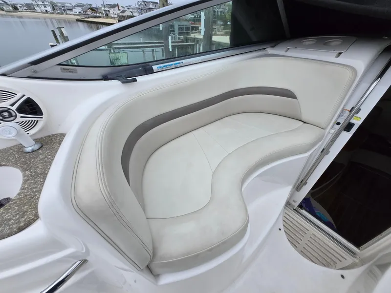 Slide: The Image of 2008 Chaparral 290 Signature boat interior with curved seating and modern design. - 15