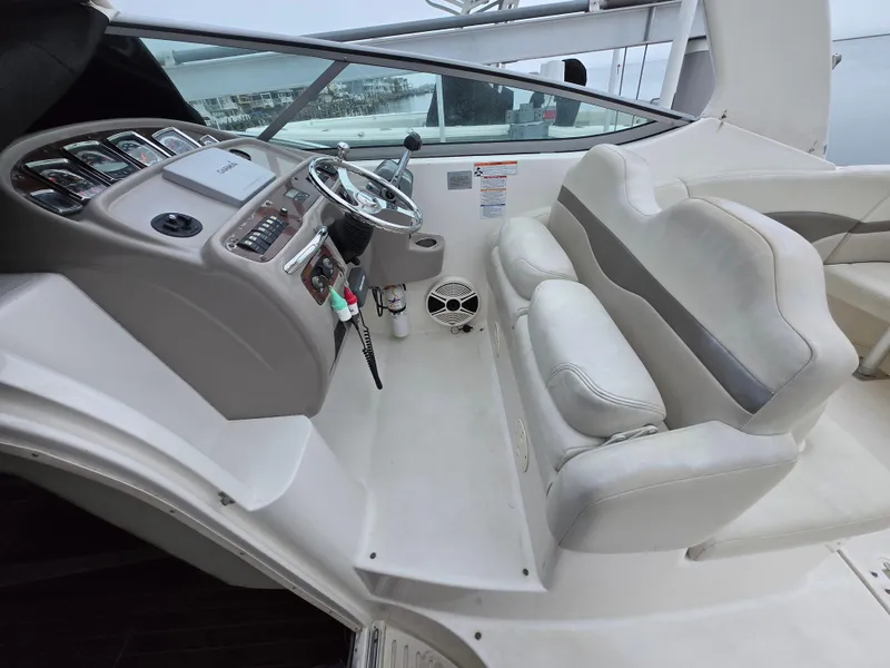 Slide: The Image of 2008 Chaparral 290 Signature boat interior with steering console and seating area. - 16