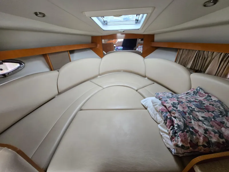 Slide: The Image of 2008 Chaparral 290 Signature cabin interior with plush seating and floral pillow. - 22