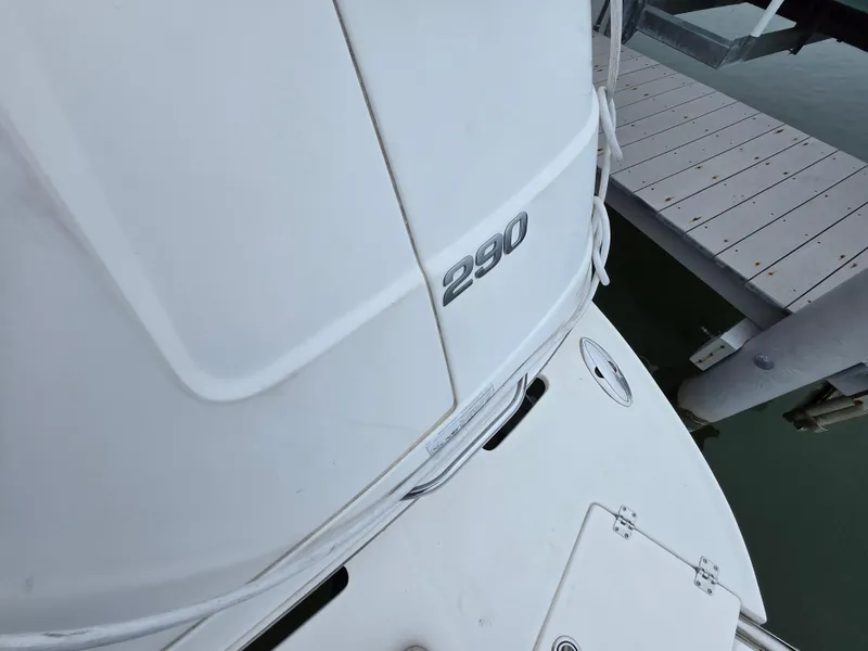 Slide: The Image of 2008 Chaparral 290 Signature boat docked, showing model number and deck details. - 26