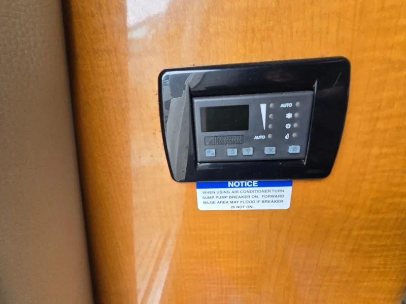 Slide: The Image of Control panel on 2008 Chaparral 290 Signature boat with notice label. - 29