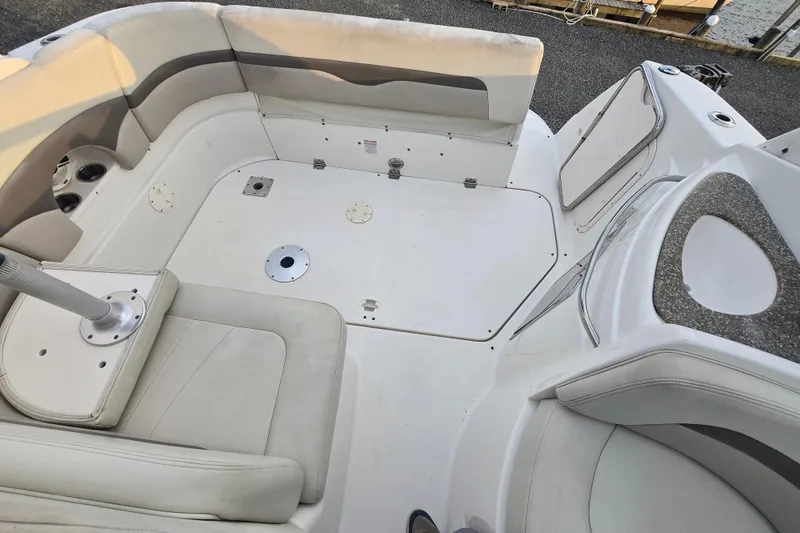 Slide: The Image of 2008 Chaparral 290 Signature boat interior with white seating and deck layout. - 44