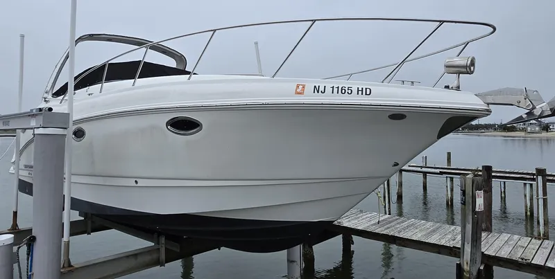 Slide: The Image of 2008 Chaparral 290 Signature boat docked, side view, with registration NJ 1165 HD. - 7