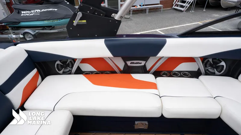 Slide: The Image of Interior of a 2019 Malibu MXZ boat with stylish seating and audio system. - 20