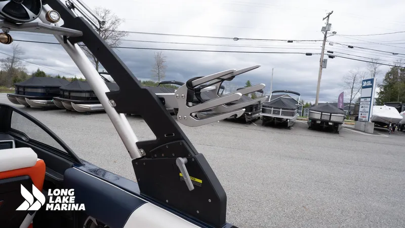 Slide: The Image of 2019 Malibu MXZ boat at Long Lake Marina with wakeboard rack. - 22