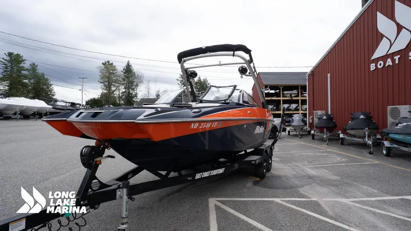 Slide: The Image of 2019 Malibu MXZ boat on trailer at Long Lake Marina. - 4