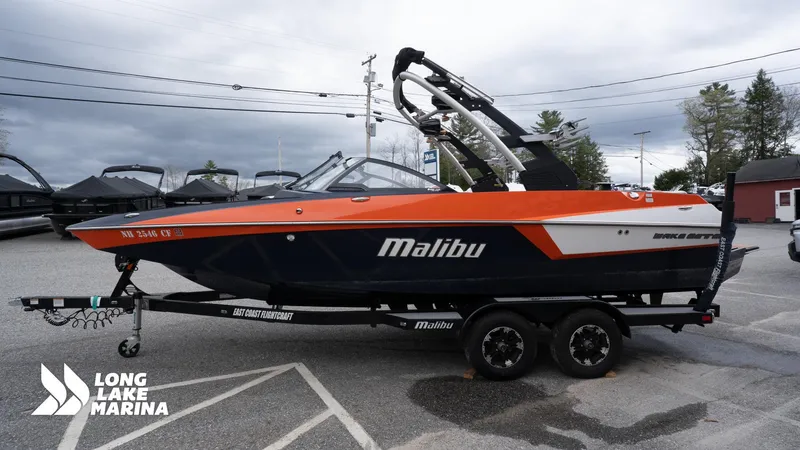 Slide: The Image of 2019 Malibu MXZ boat on trailer at Long Lake Marina. - 5
