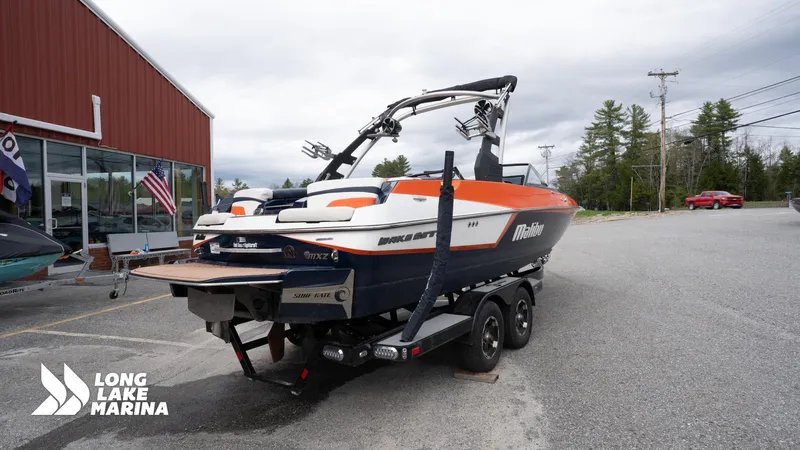 Slide: The Image of 2019 Malibu MXZ boat on trailer at Long Lake Marina. - 8