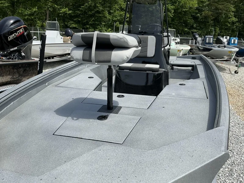 Slide: The Image of 2025 Excel Bay Pro 203 ELITE boat with seating, displayed outdoors. - 4