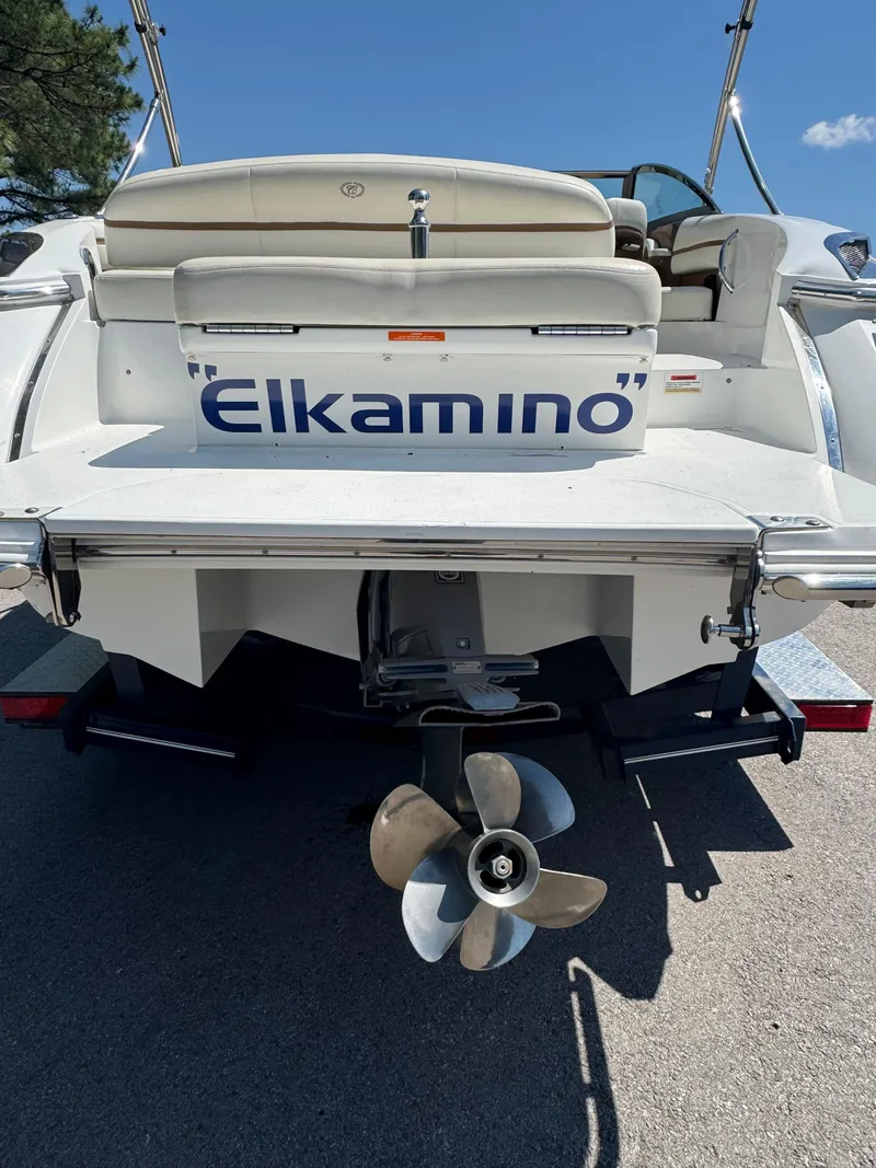 Slide: The Image of 2015 Cobalt R3 boat named "Elkamino" with visible propeller and seating area. - 11
