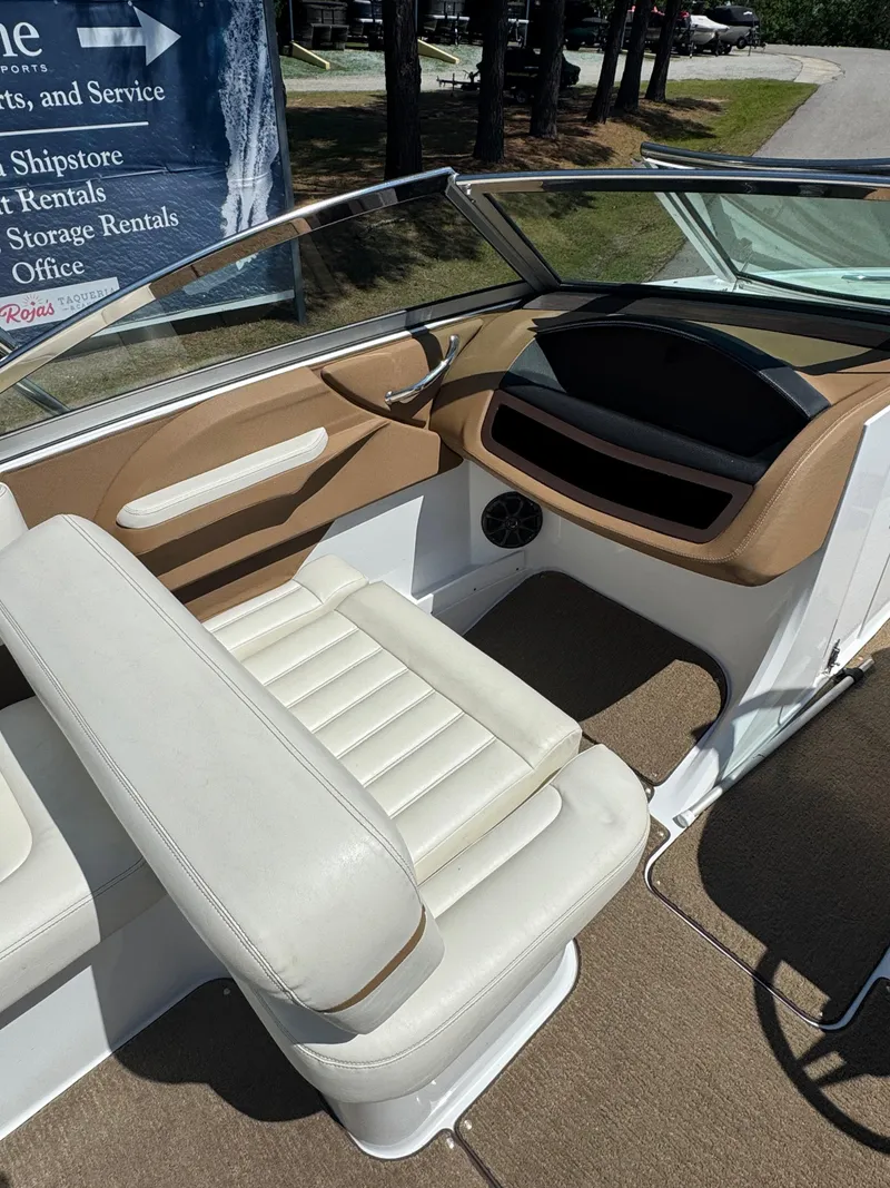 Slide: The Image of Interior of a 2015 Cobalt R3 boat with beige and white seating. - 3