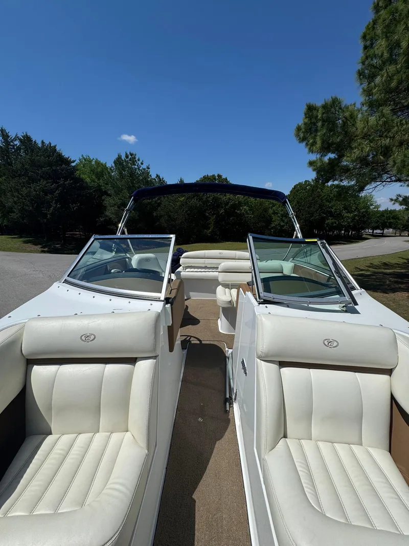 Slide: The Image of 2015 Cobalt R3 boat interior with white leather seats and open windshield. - 7